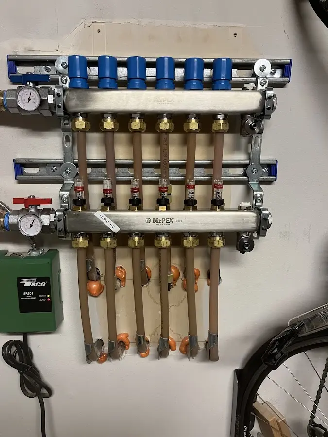 Plumber performing Water Heater Repair at a residential property in Madison Heights